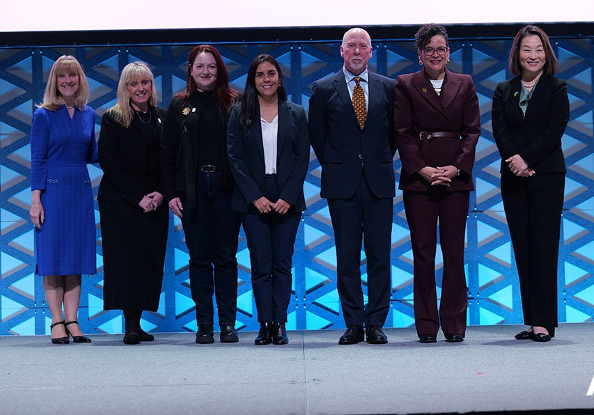 AASCB and UCSD recipients of award on stage